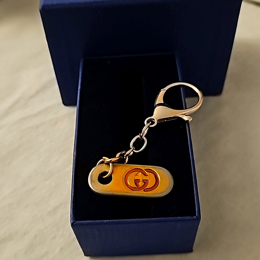 Auth Gucci Charm/ zipper pull/keychain, some wear,good condition silver and gold